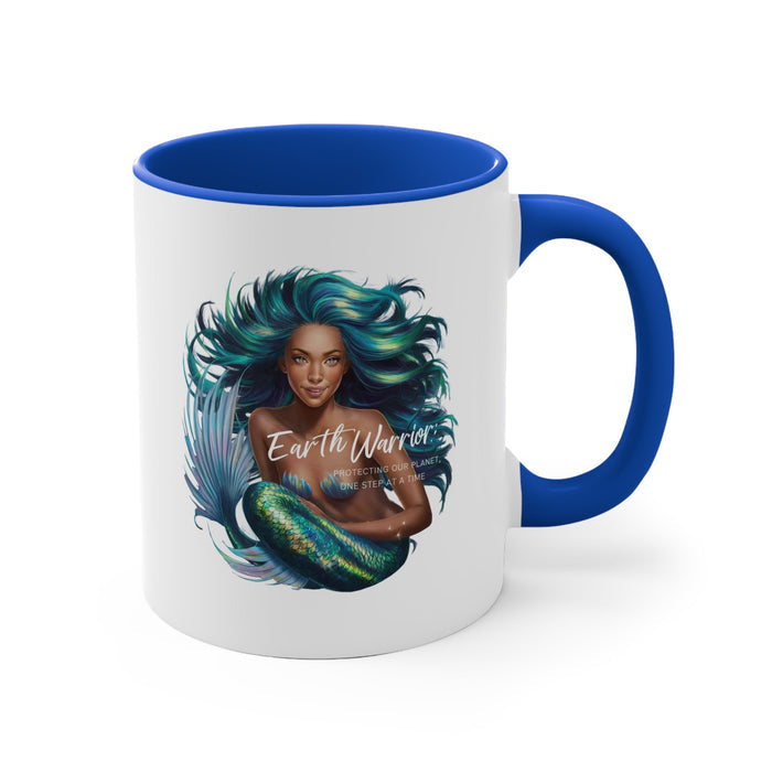Blue-accent ceramic mug with teal-haired woman portrait and feather illustration, blue handle.