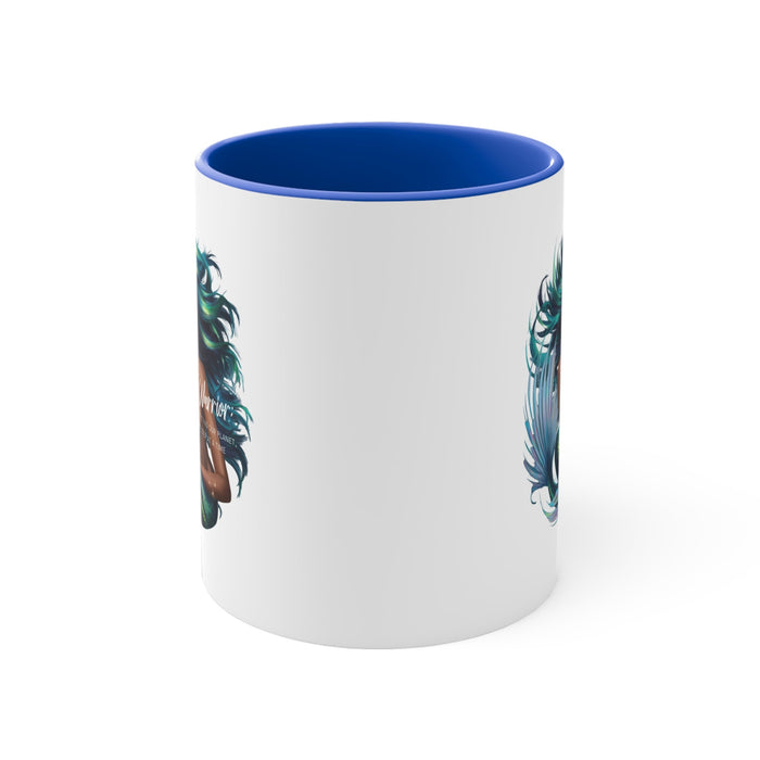 Blue-accent ceramic mug with teal feather artwork on white side, blue rim.