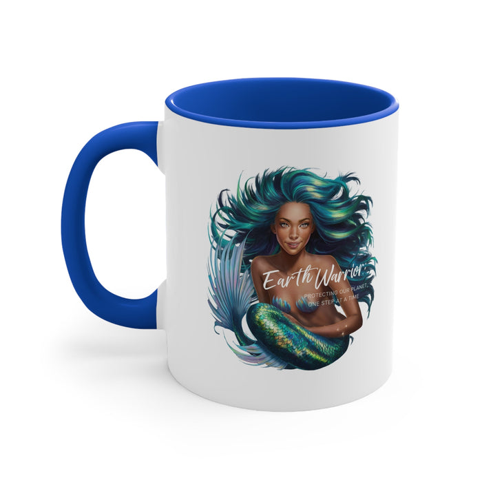 Blue-accent ceramic mug with mermaid-style woman graphic, teal hair, blue handle.