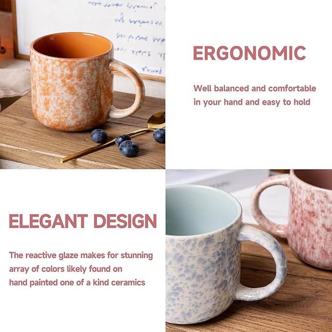 Speckled ceramic coffee mugs with curved handles, featuring orange and pink reactive glaze