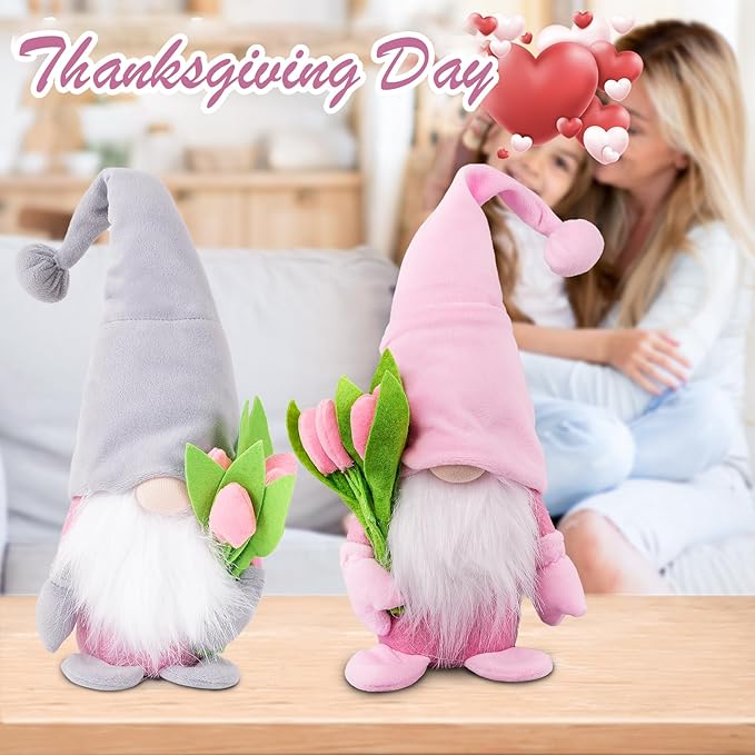 Pink and gray plush gnome decorations with white beards and green-pink flower heads