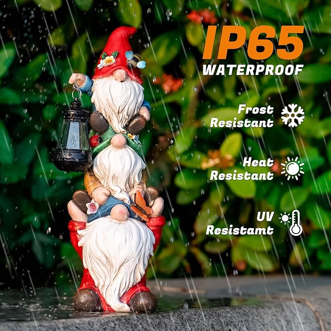 Triple outdoor garden gnome statue with white beard, red hat, and lit solar lantern