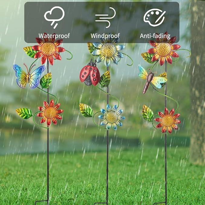 Three metal garden stakes with sunflowers, butterflies, ladybug, and dragonfly weather art