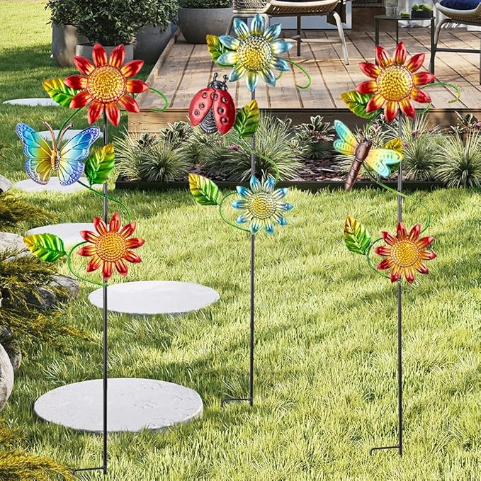 Three metal garden stakes with red and blue sunflowers, butterflies, ladybug, and dragonfly