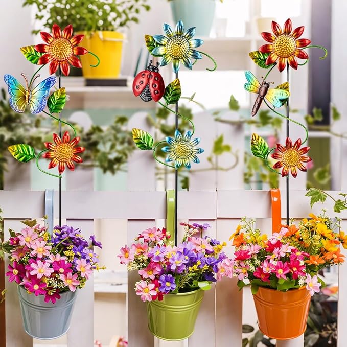 Three metal garden stakes with sunflower blooms, butterflies, ladybug, and dragonfly