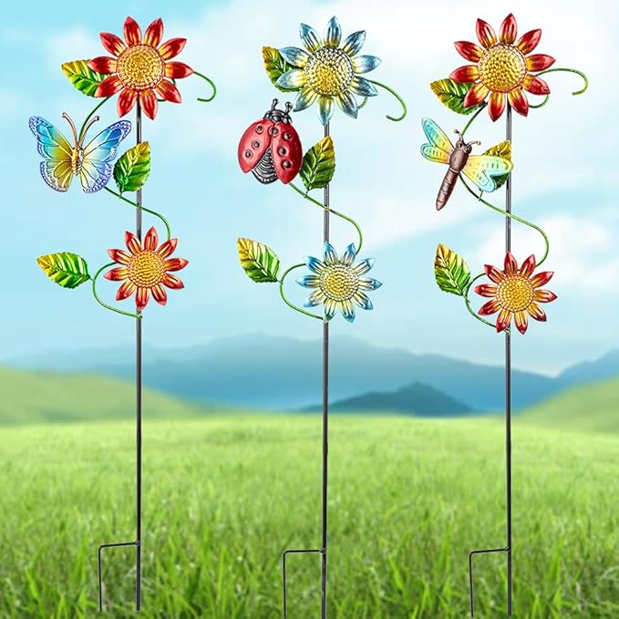 Three metal garden stakes with sunflowers, butterflies, ladybug, and dragonfly yard decor