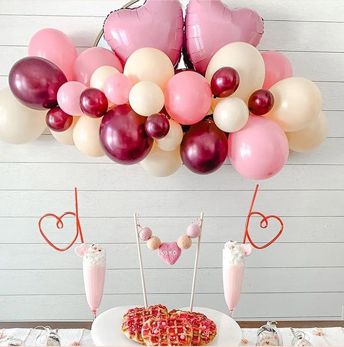 Pink and burgundy balloon garland with heart-style decorations, 5 ft length