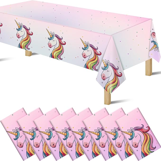 Unicorn pink plastic tablecloth with rainbow unicorn heads and star confetti, disposable