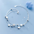 Sterling silver star charm bracelet with five-point stars and round bead accents