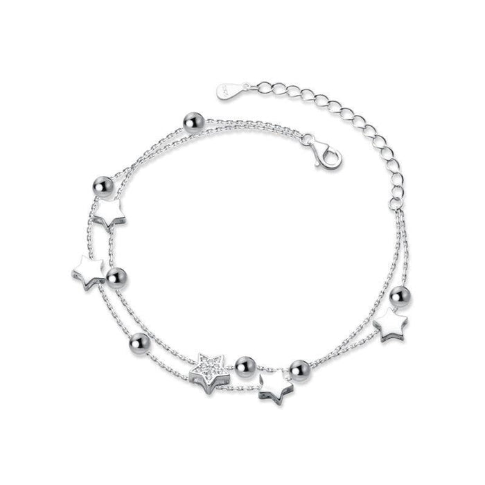 Sterling silver star charm bracelet with multiple star charms and ball bead links