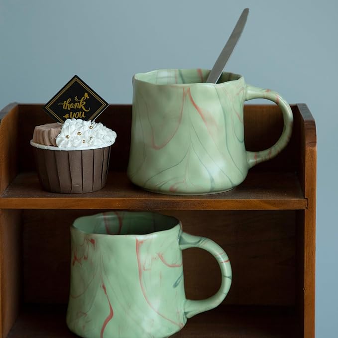 Mint green ceramic coffee mugs set with red and white abstract pattern, mug with spoon