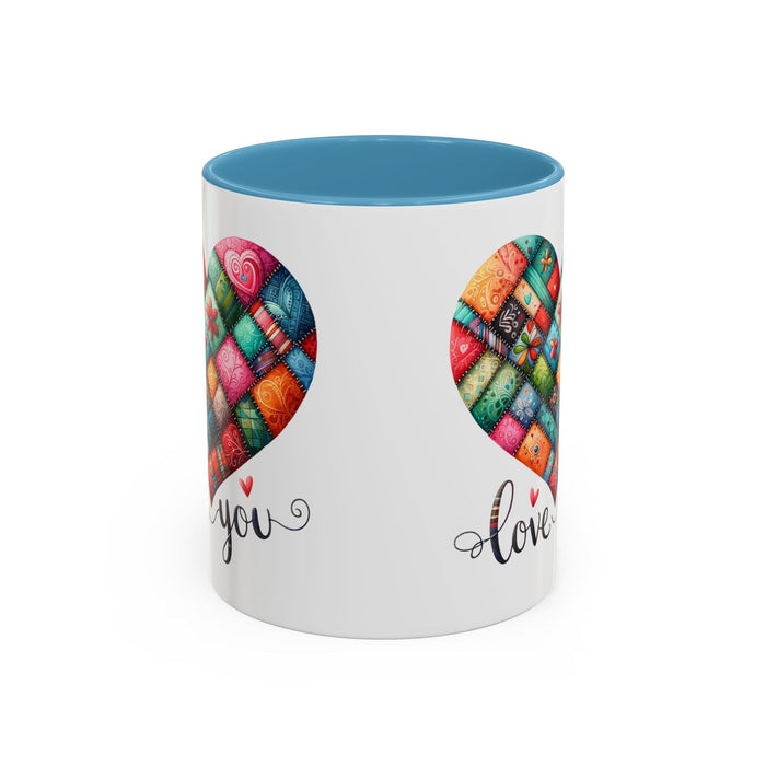 White coffee mug with colorful quilt heart print, you and love text, light blue rim.