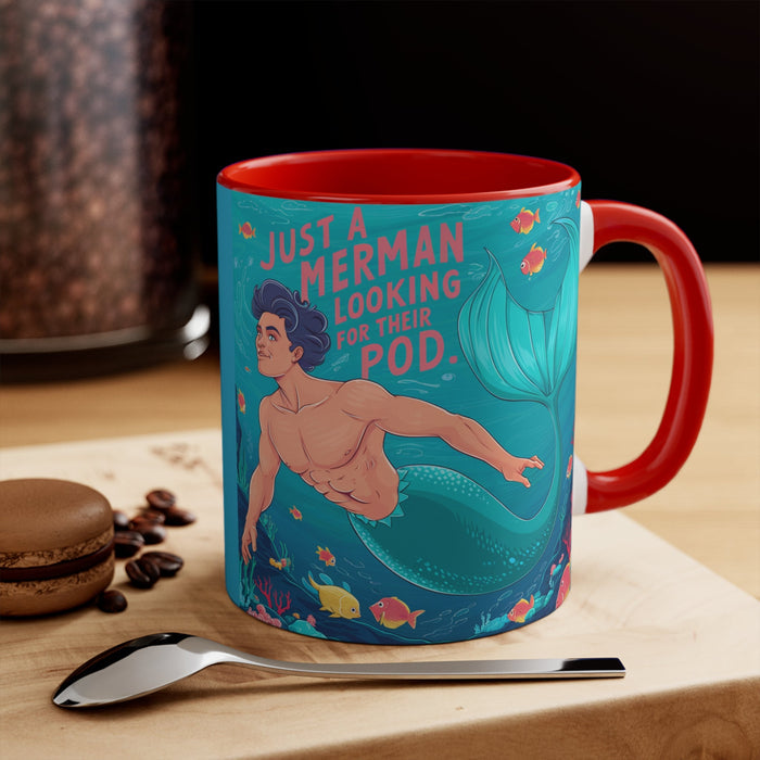Red accent mug with teal mermaid illustration and “Pod” text on the front, showing handle.