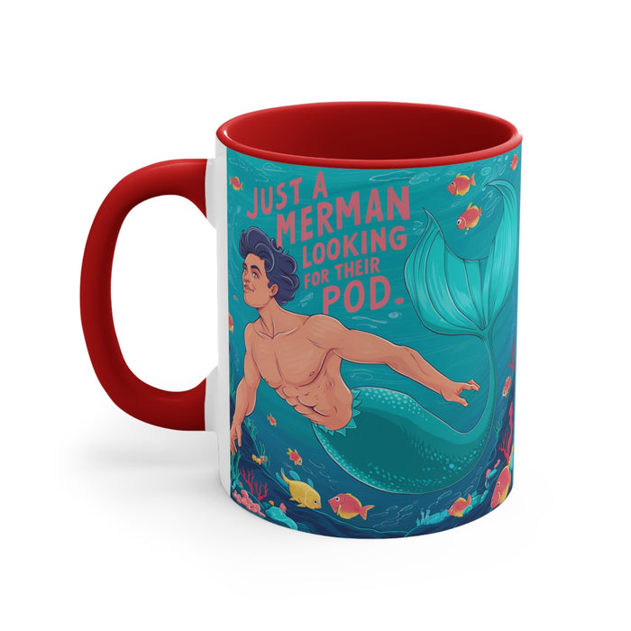 Red accent mug with teal “merman looking for their pod” design and mermaid tail graphic.