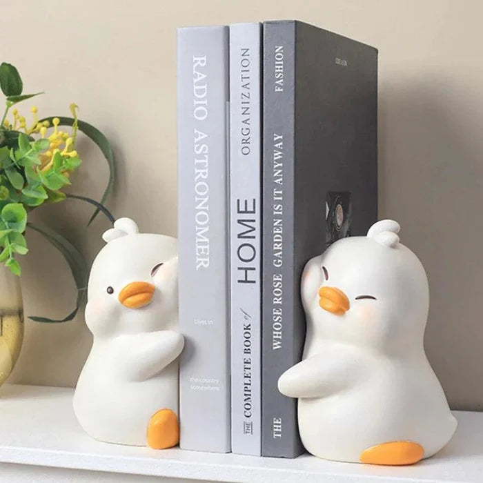 White duck book ends, set of two, holding books upright