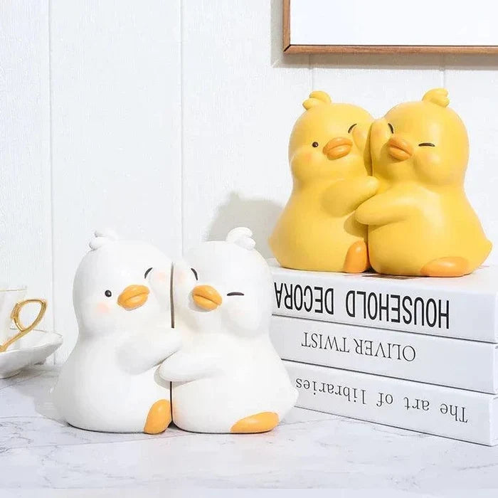 White and yellow duck book ends grouped on books