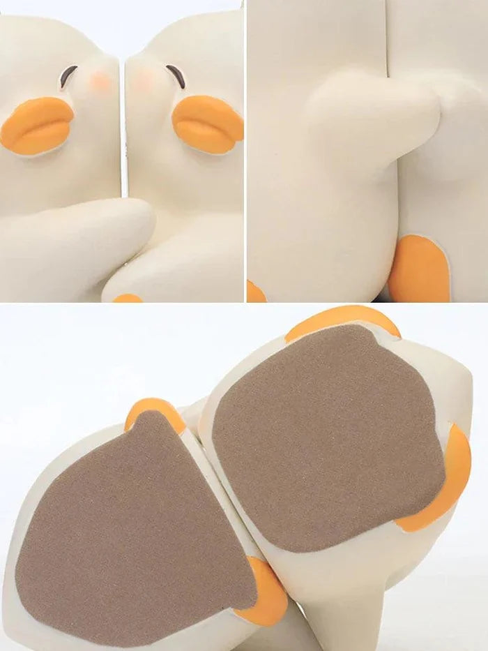 Duck book ends bottom view with dark gray pads and orange feet