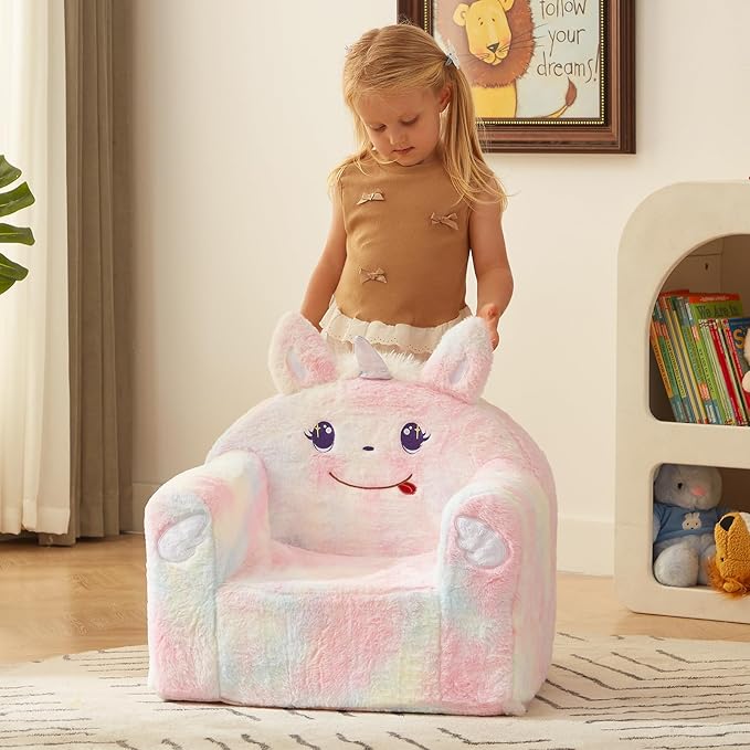 Unicorn plush toddler chair with pastel rainbow pattern and wide arm cushions