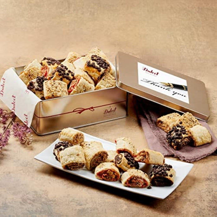 Gold rugelah assortment tin open with assorted rugelah pieces and paper liners
