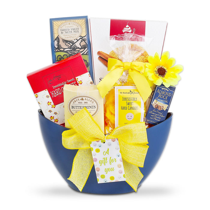 All Smiles gift basket with blue hamper and bright yellow ribbon, filled with treats