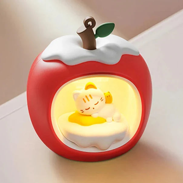 Apple-shaped night light with warm glow, red round body and white cloud lid.