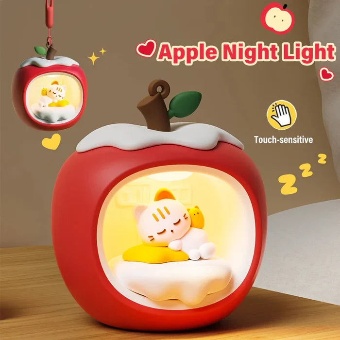 Apple cat nap night light on base, red body with glowing window and cat sleeping scene.
