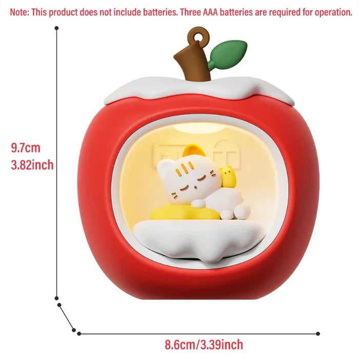 Apple-shaped cat nap night light with glowing window, red body and white cloud top.