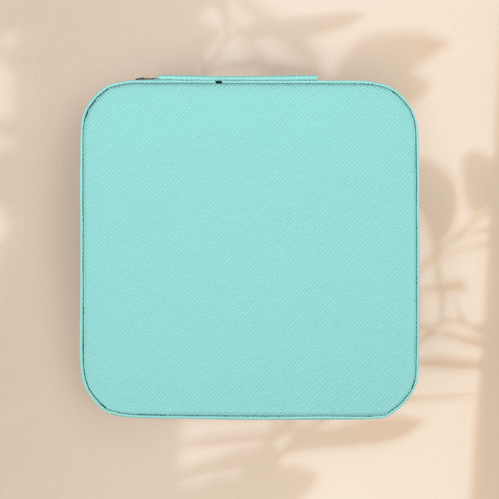 Compact zodiac travel jewelry case, turquoise closed with zipper and rounded corners