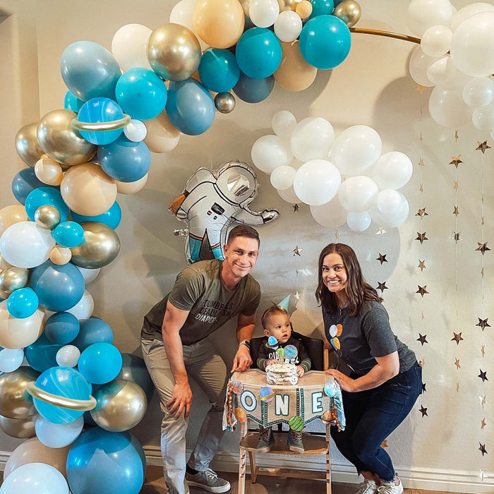Astronaut balloon garland arch with blue and gold balloons plus 'ONE' number backdrop