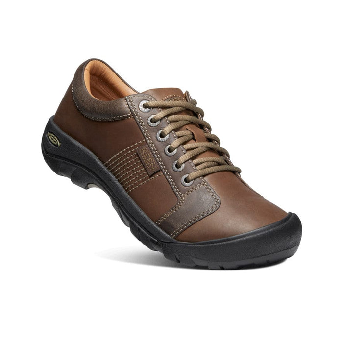 Keen Austin casual shoes in brown leather with contrast stitching, lace-up design, and black rubber outsole, angled side view.