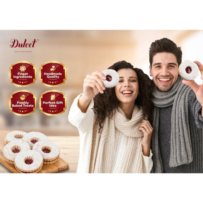 Dulcet gift basket cookies held by a smiling couple wearing winter scarves