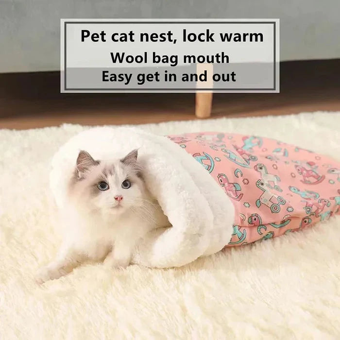 Closed cat sleeping bag with plush hood; cat inside pink cartoon pattern