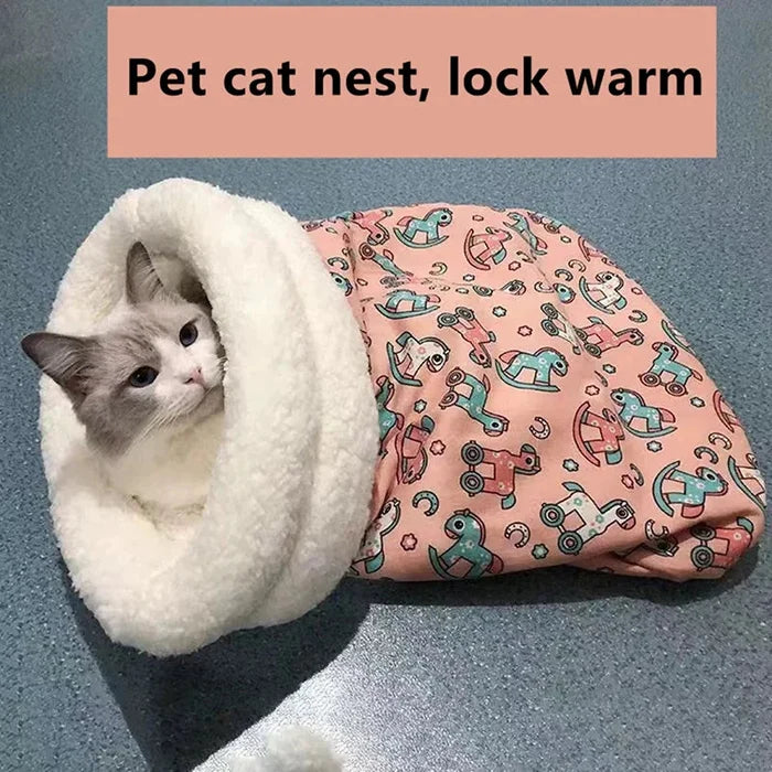Closed cat sleeping bag with plush rim; gray cat inside pink robot-print cover