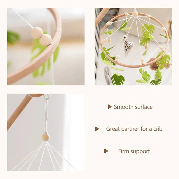 Crib mobile with wooden ring and smooth dangling cords with forest animal charm toys