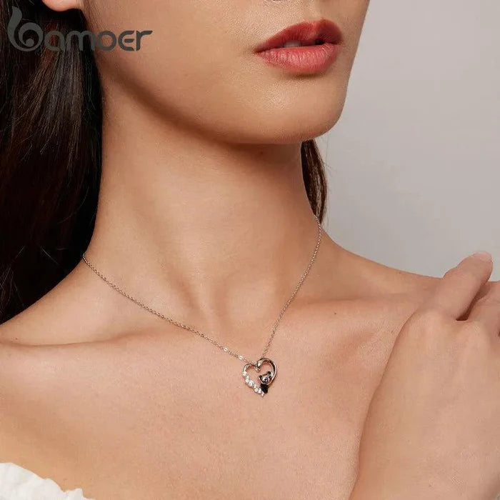 Sterling silver heart necklace with small panda face charm on a link chain