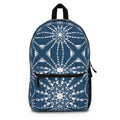 Blue compass print backpack with front zipper pocket and black top handle