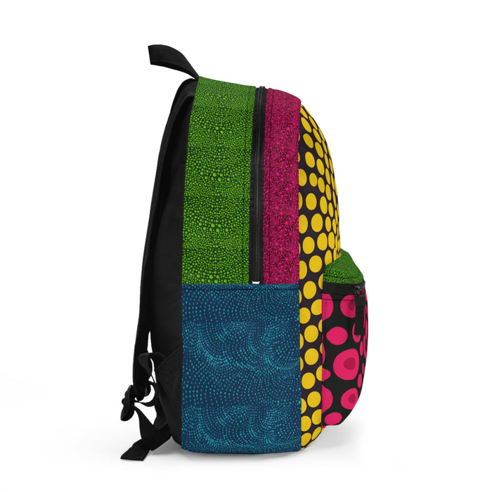 Mini backpack side view with black straps, green speckle panel, magenta stripe, blue pocket