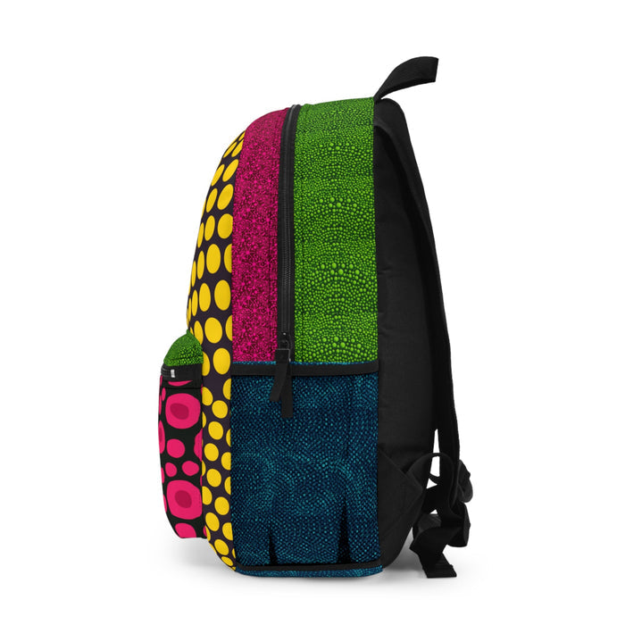 Mini backpack angled view with yellow dot side, green and magenta panels, blue lower section