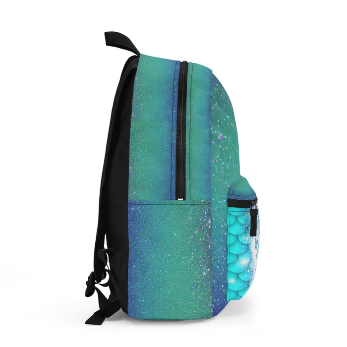 Teal-to-blue gradient backpack with side pocket, mermaid scale panel, and black straps