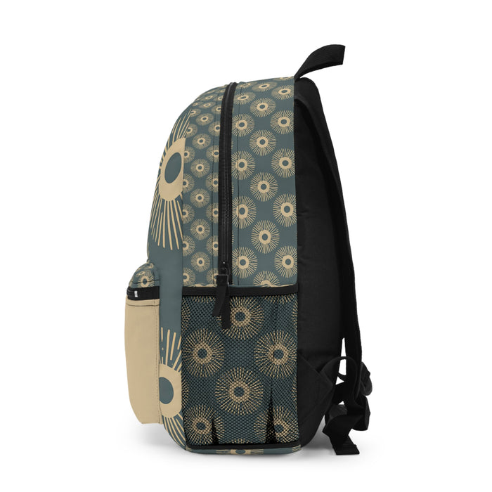 Patterned teal backpack with front pocket and black shoulder straps, small side pouch