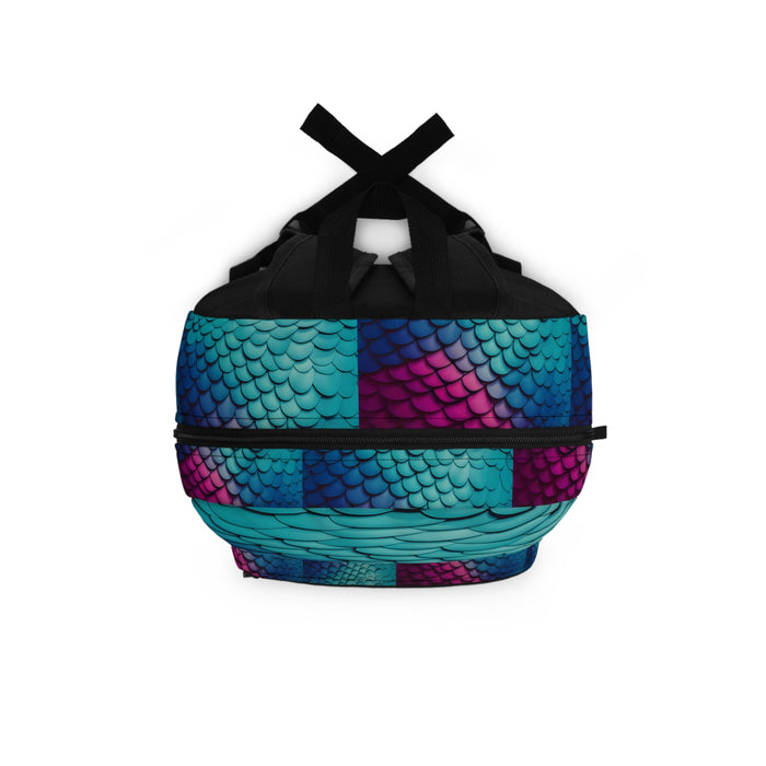 Mermaid-scale backpack with top handle and crisscross straps over teal, blue and magenta shell.