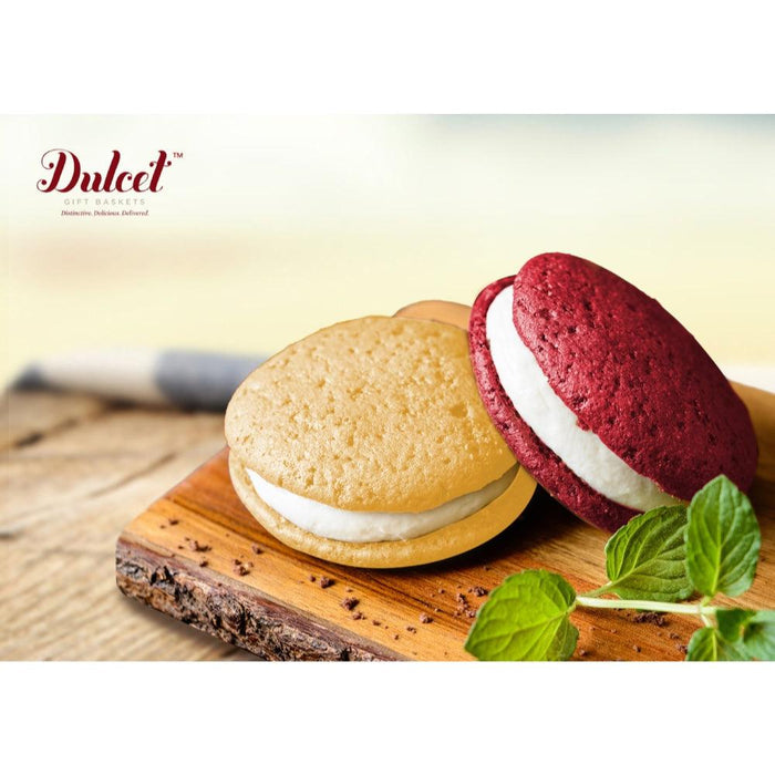 Red and beige sandwich cookies with white filling on a wooden board