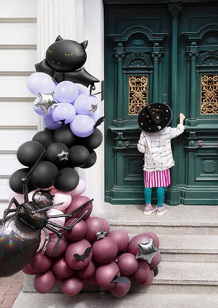 Black, pink, and purple Halloween balloon garland cluster with bat and spider shapes