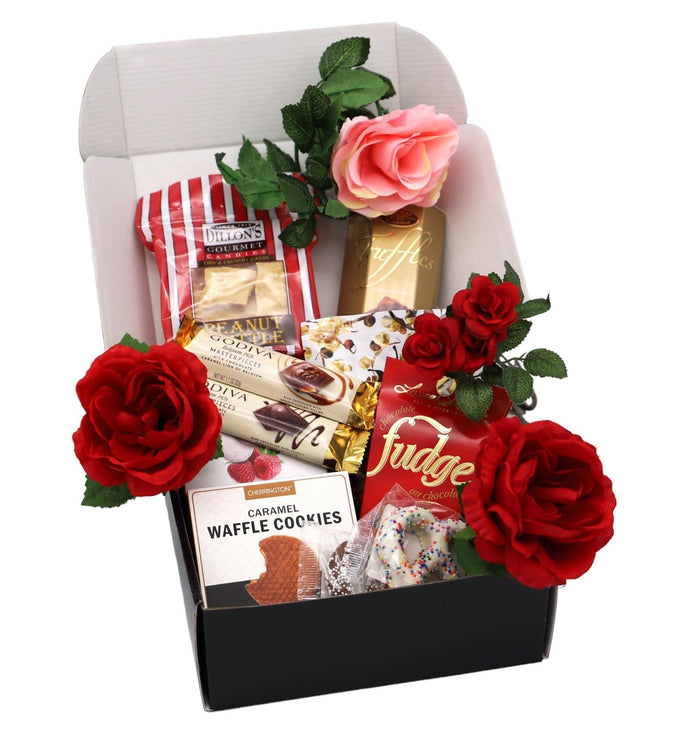 Valentine gift box with light pink lid, black base, red roses and pink rose, assorted treats