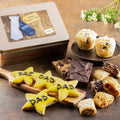 Gift tin with star-shaped dad cookies and assorted brownies, with blue ribbon accent