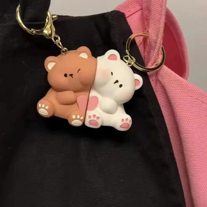 Magnetic bear keychain pair on a bag: brown and white bears with gold rings