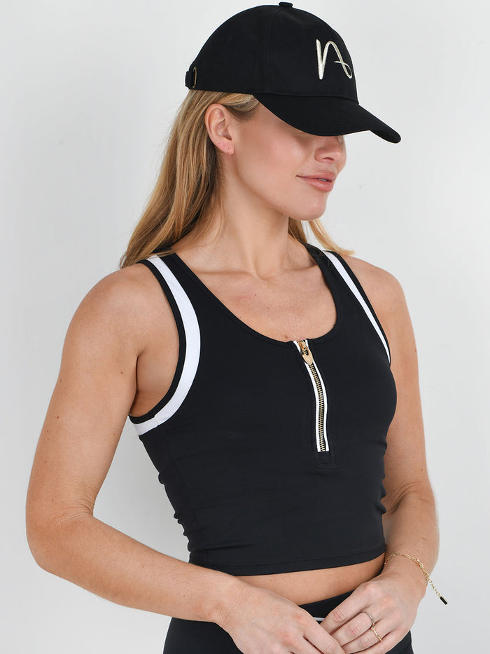 NAIA logo black baseball cap from NAIA active collection worn with Thebillie cropped vest black and white