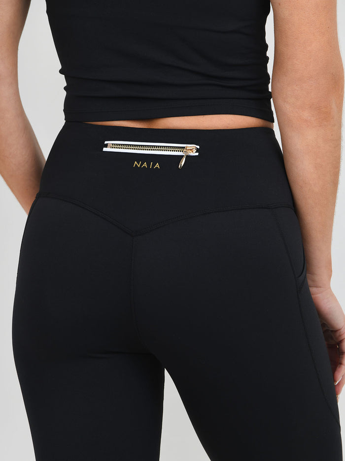 Billie  legging in black with white piping detAil from NAIA Active active wear collection