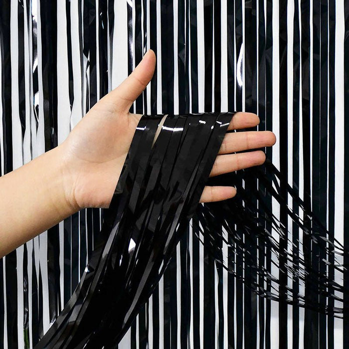 Black metallic fringe curtain panel, with long dangling strip ends