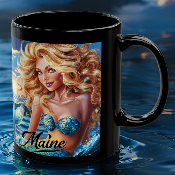 Black mug with blonde mermaid artwork in blue bikini and 'Maine' lettering